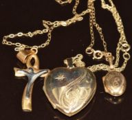 A 9ct gold heart locket set with a diamond, two 9ct gold chains (4.4g) and an 18ct gold pendant (1.