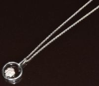 An 18ct white gold pendant set with diamonds in a flower cluster by Leo Willwer (1.6cm) on