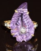 A 9ct gold ring set with a carved amethyst in the form of a leaf and diamonds, 4g, size N