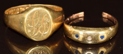 An 18ct gold signet ring (Chester 1909, 6.6g, band has been cut) and damaged 18ct gold ring (2.1g)