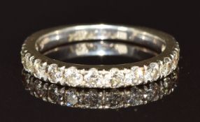 An 18ct gold half eternity ring set with fifteen brilliant cut diamonds, the total diamond weight