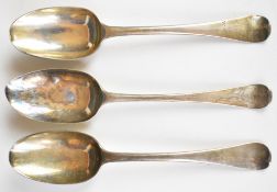 Three possibly Queen Anne and Georgian hallmarked silver table spoons including a Britannia standard