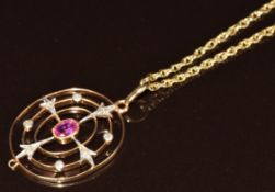Edwardian 9ct gold pendant set with an oval cut pink sapphire and rose cut diamonds (2.6 x 2.2cm),