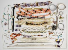 A collection of jewellery, some silver including a bangle, bracelet, four chains, two pairs of