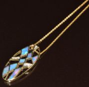 A 14k gold oval pendant set with black opals and diamonds (3cm) on 14k gold chain, 6.3g, 43cm