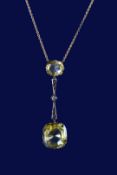 Belle Époque necklace set with two cushion cut yellow sapphires of approximately 14.6ct and 2.9ct