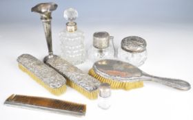 Hallmarked silver mounted items comprising spill vase, four various glass bottles, three brushes and