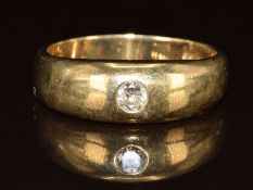 A 9ct gold ring set with a round cut diamond of approximately 0.15ct, 7.6g, size U