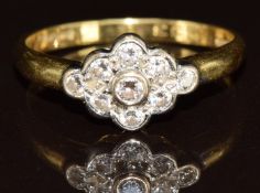 An 18ct gold ring set with diamonds in a flower cluster, total diamond weight 0.33ct, 3.7g, size P