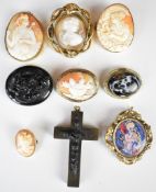 Four Victorian brooches set with cameos (one damaged), Vulcanite/ gutta-percha cross, carved jet