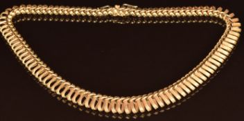 An 18ct gold necklace made up of textured loop links and plaited links, 77.9g, 44cm