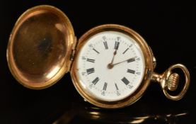 Unnamed yellow metal keyless winding full hunter pocket watch with gold hands, black Roman numerals,