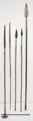 AUCTIONEER ANNOUNCE ONLY SPEARS NO AXE: Five tribal spears, all with wooden shafts and metal tips,