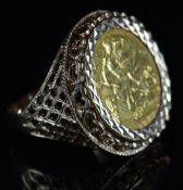 A 9ct gold ring set with a 1932 gold half sovereign, 8.5g, size R