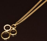 An 18ct gold pendant made up of four circles set with diamonds (2.8cm) on double 18ct gold chain