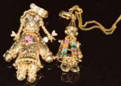 Two 9ct gold pendants, one in the form of a rag doll set with cubic zirconia (3.5cm) and the other
