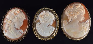 Three 9ct gold brooches set with cameos depicting young women, 29g, largest 4.6 x 3.6cm