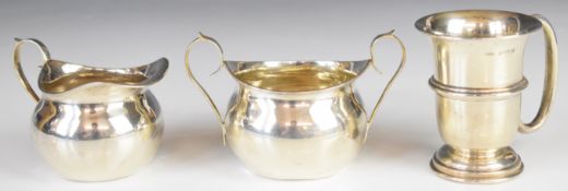 George V hallmarked silver sugar bowl and milk jug of bulbous form together with a hallmarked silver