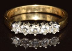 An 18ct gold ring set with five round cut diamonds, each approximately 0.12ct, 3.2g, size P