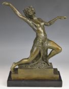 Art Deco style bronze study of a dancer with leaf headdress, on a stepped plinth and mounted on a
