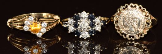 Three 9ct gold rings, one set with topaz and cubic zirconia, one sapphire and diamonds and the other