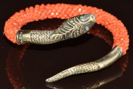 A c1900 French silver gilt serpent bangle set with green paste eyes and beaded coral body, 23.8g