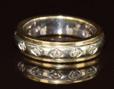 A 9ct gold bi-coloured ring set with five diamonds, 5g, size H