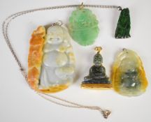 Five jade, jadeite or similar hardstone pendants four featuring gods or buddhas, two in metal