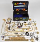 A collection of costume jewellery including two faux pearl necklaces with gold clasps, three