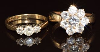 Two 9ct gold rings, one set with three diamonds (total 0.5ct) and the other cubic zirconia, 6.5g,