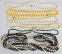 Five cultured pearl necklaces, four with 14k gold claps and one with 9k gold clasp, together with