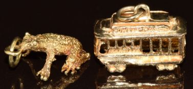 Two 14k gold charms, one in the form of a frog the other in the form of a tram, 6.9g