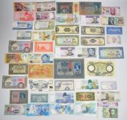 A collection of over forty-five world banknotes from various countries c.1919-2021, many in very