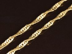 A 14k gold necklace made up of twisted curb links,16.2g, 58cm