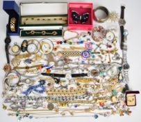 A collection of jewellery including Kirks Folly brooches, other brooches including lacquer, silver