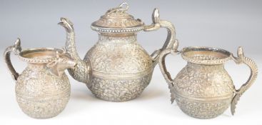 Indian Kutch silver tea set, comprising teapot, sugar bowl and milk jug, each with embossed