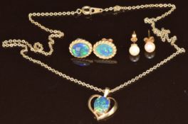 A pair of 18ct gold earrings set with pearls (0.9g), a pair of 9ct gold earrings and a pendant set