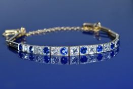 Art Deco bracelet set with seven graduated diamonds alternated with eight graduated sapphires, the