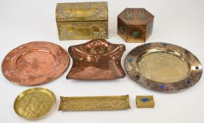 Arts and Crafts and later copper and brass chargers, biscuit tin, pin/pen trays and a hinged box,