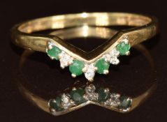 A 9ct gold ring set with emeralds and diamonds in a V setting, 1.7g, size R