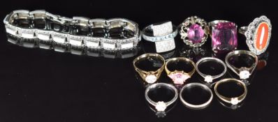 Two 9ct gold rings (3.3g), nine silver rings and a silver bracelet (51g)