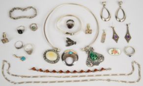 A collection of silver jewellery including bangle, curb link necklace, bracelet, pressed amber