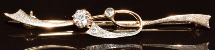A 14k rose gold brooch set with a rose cut and old cut diamonds, largest diamond 0.15ct, 2.9g, 4.