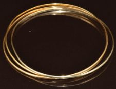 An 18ct gold bracelet made up of three bangles, by Uno-A-Erre, 13.9g, 6.4cm