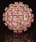 A 14k gold ring set with rubies in domed setting, 5.1g, size P