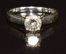 An 18ct white gold ring set with a round brilliant cut diamond of approximately 0.72ct, with GIA