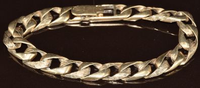 A 9ct gold curb link bracelet with textured links, 30.6g, 20.5cm