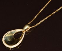 An 18ct gold pear shaped pendant set with diamonds (total 0.32ct, 3.2cm) on 18ct gold chain, 44cm,