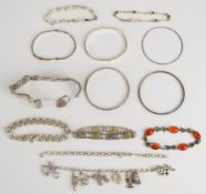 Seven silver bracelets including one with buckle decoration, agate and marcasite, curb link,
