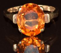 A 9ct gold ring set with an oval cut synthetic sapphire, 4.4g, size P